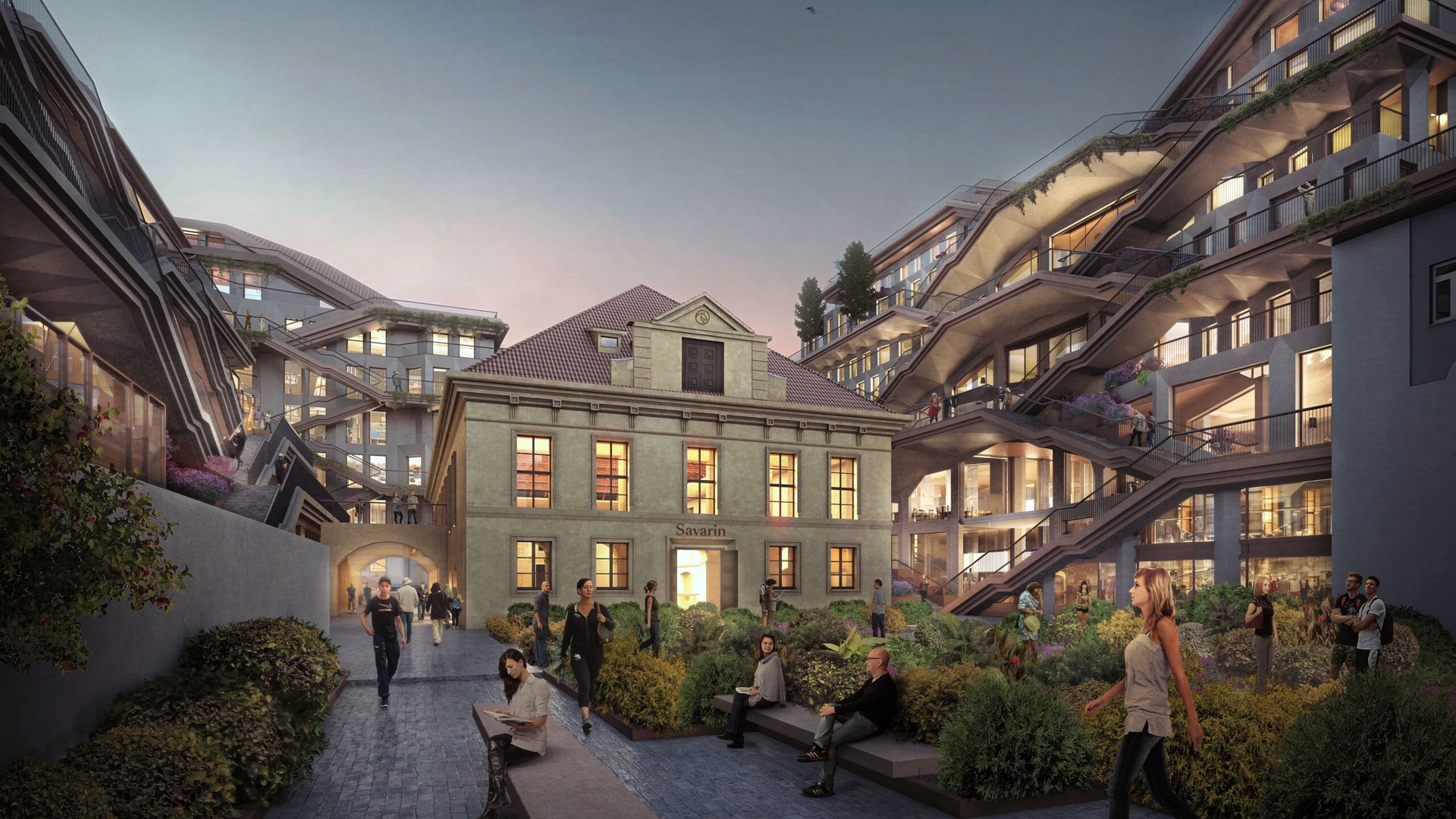 Savarin courtyard at dusk in Prague, with the historic riding hall framed by planted terraces. Image: Heatherwick Studio.